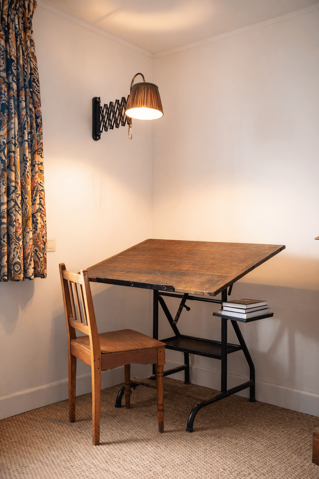 man wearing blue dress shirt in front of industrial machine